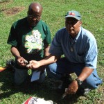 Terry Noel and Cristo Adonis collect clay in Trinidad